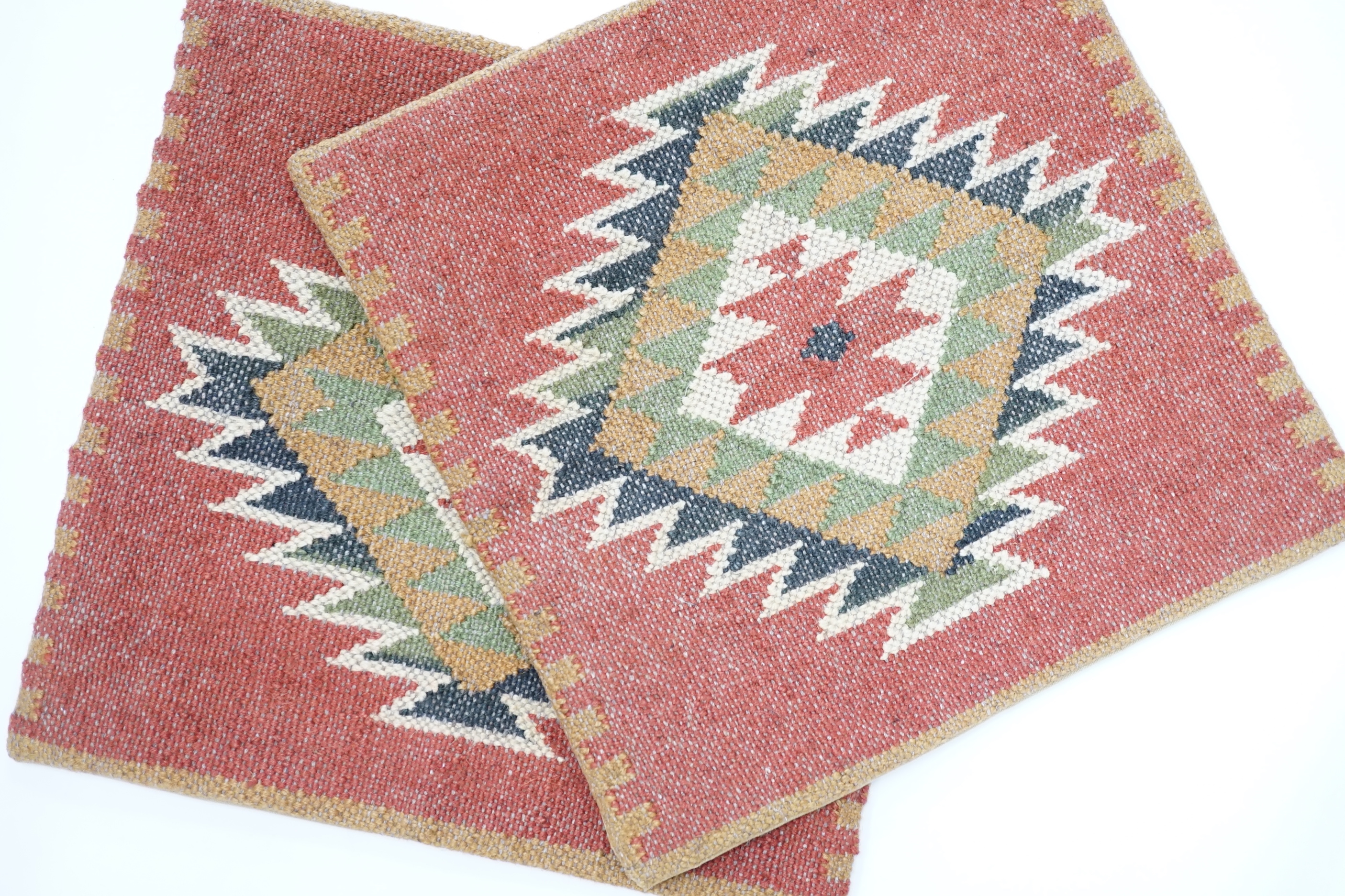 A pair of woven Kelim cushion covers with geometric design, 46cm x 46cm